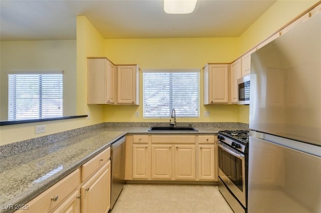 5250 S Rainbow Blvd Unit 2101, Las Vegas, NV 89118 - kitchen with appliances with stainless steel finishes, healthy amount of natural light, light tile patterned floors, and light stone counters