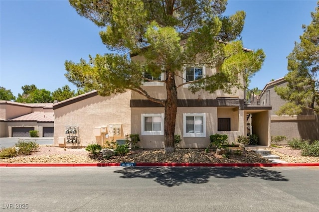 5250 S Rainbow Blvd Unit 2101, Las Vegas, NV 89118 - view of front of house featuring stucco siding and a balcony