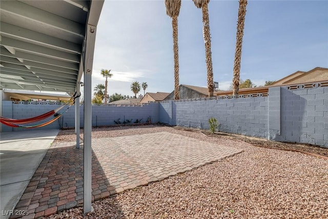 59 N Christy Ln, Las Vegas, NV 89110 - fenced backyard with a patio area