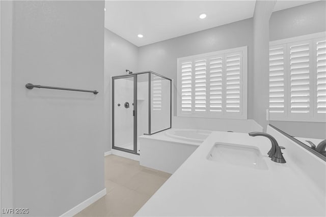 11909 Pippa Ave, Las Vegas, NV 89138 - bathroom featuring a shower stall, a garden tub, recessed lighting, and tile patterned floors