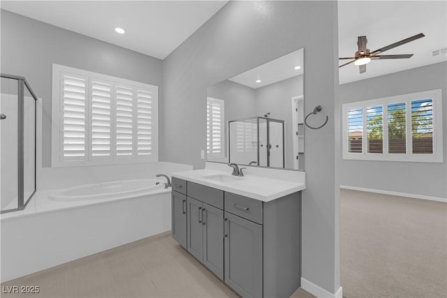 11909 Pippa Ave, Las Vegas, NV 89138 - full bathroom featuring a bath, a stall shower, a ceiling fan, vanity, and recessed lighting
