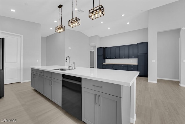 11909 Pippa Ave, Las Vegas, NV 89138 - kitchen featuring dishwasher, gray cabinetry, light countertops, decorative light fixtures, and lofted ceiling