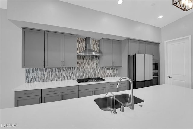 11909 Pippa Ave, Las Vegas, NV 89138 - kitchen with gray cabinets, wall chimney range hood, appliances with stainless steel finishes, backsplash, and recessed lighting