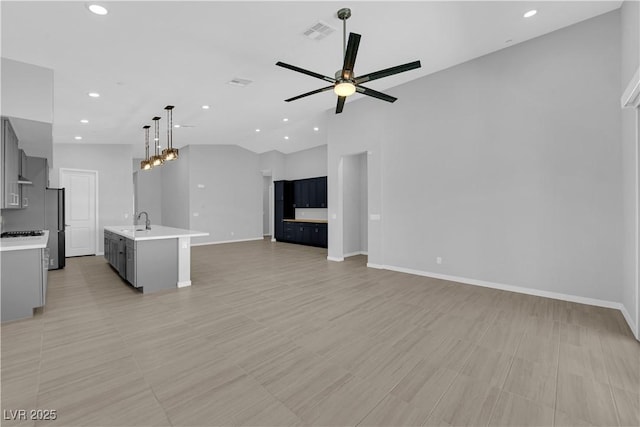 11909 Pippa Ave, Las Vegas, NV 89138 - unfurnished living room with ceiling fan, recessed lighting, and lofted ceiling