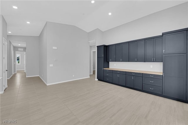 11909 Pippa Ave, Las Vegas, NV 89138 - kitchen featuring light countertops, vaulted ceiling, and recessed lighting