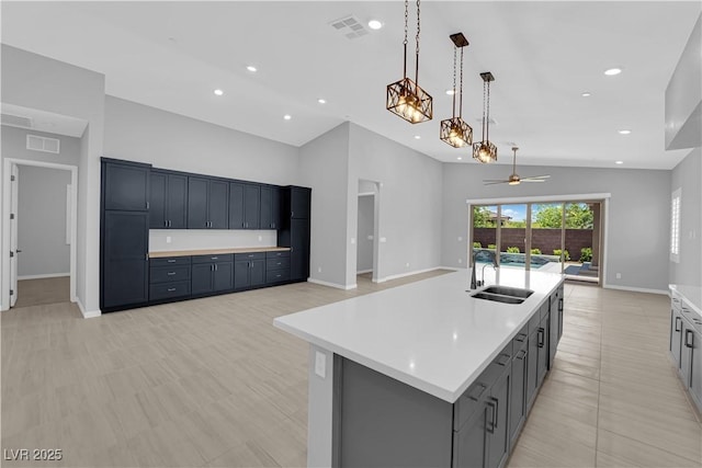 11909 Pippa Ave, Las Vegas, NV 89138 - kitchen featuring open floor plan, ceiling fan, vaulted ceiling, light countertops, and recessed lighting