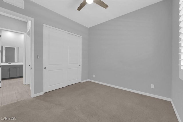 11909 Pippa Ave, Las Vegas, NV 89138 - unfurnished bedroom with light colored carpet, a closet, lofted ceiling, and ceiling fan