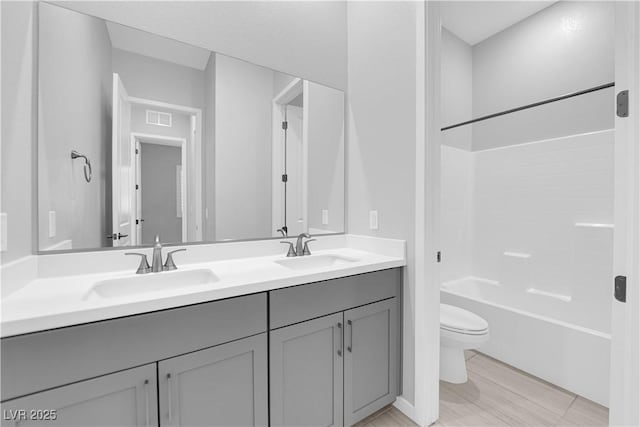 11909 Pippa Ave, Las Vegas, NV 89138 - full bathroom with double vanity, bathing tub / shower combination, and wood finished floors