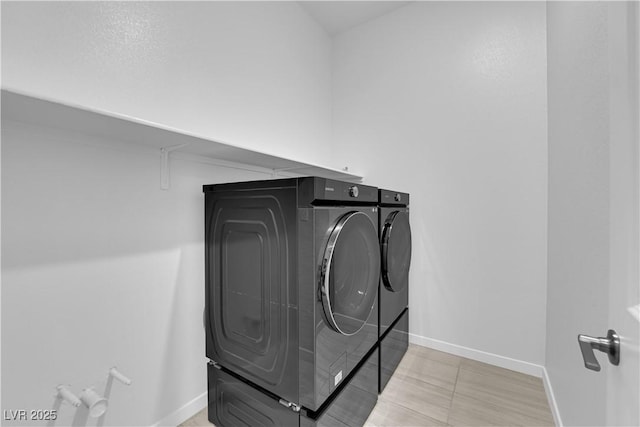 11909 Pippa Ave, Las Vegas, NV 89138 - washroom featuring washing machine and clothes dryer and baseboards