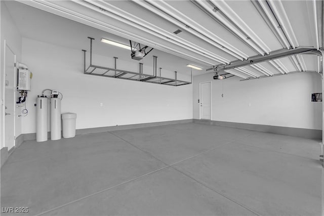 11909 Pippa Ave, Las Vegas, NV 89138 - garage with a garage door opener and water heater