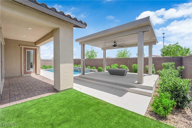 11909 Pippa Ave, Las Vegas, NV 89138 - fenced backyard featuring a patio area and a ceiling fan