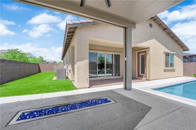 11909 Pippa Ave, Las Vegas, NV 89138 - rear view of property with a fire pit, stucco siding, a fenced backyard, and a patio