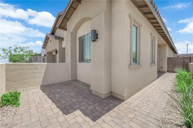 11909 Pippa Ave, Las Vegas, NV 89138 - view of home's exterior featuring stucco siding and a patio
