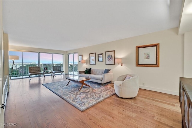 3111 Bel Air Dr Unit 7D, Las Vegas, NV 89109 - living area with light wood-style flooring and baseboards