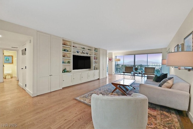 3111 Bel Air Dr Unit 7D, Las Vegas, NV 89109 - living room with light wood finished floors and baseboards
