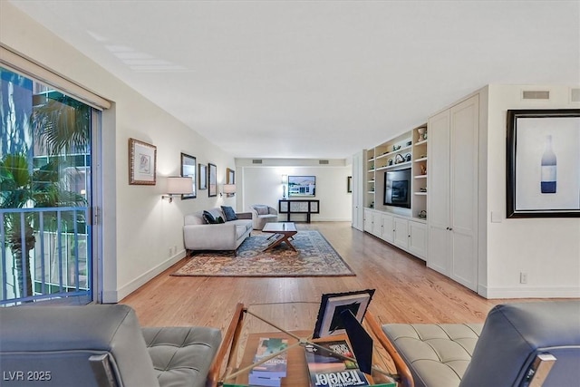 3111 Bel Air Dr Unit 7D, Las Vegas, NV 89109 - living area with baseboards and light wood finished floors