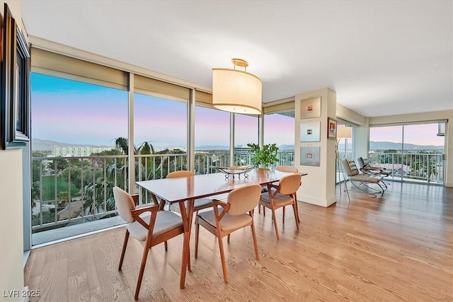 3111 Bel Air Dr Unit 7D, Las Vegas, NV 89109 - dining space featuring wood finished floors