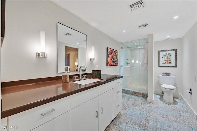 3111 Bel Air Dr Unit 7D, Las Vegas, NV 89109 - bathroom featuring a stall shower, vanity, and recessed lighting