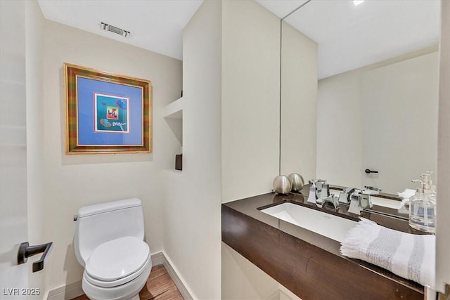 3111 Bel Air Dr Unit 7D, Las Vegas, NV 89109 - bathroom with vanity and wood finished floors