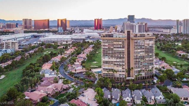 3111 Bel Air Dr Unit 7D, Las Vegas, NV 89109 - aerial view at dusk of a city view and a mountain view