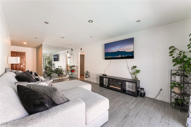 2990 Carnelian St, Las Vegas, NV 89121 - living room featuring wood finished floors, recessed lighting, and crown molding