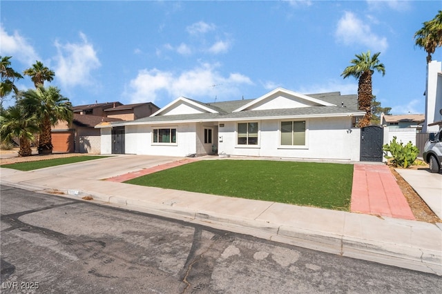2990 Carnelian St, Las Vegas, NV 89121 - view of front of property with a gate, stucco siding, and driveway