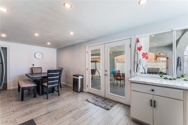 2990 Carnelian St, Las Vegas, NV 89121 - dining space with french doors, light wood finished floors, and recessed lighting