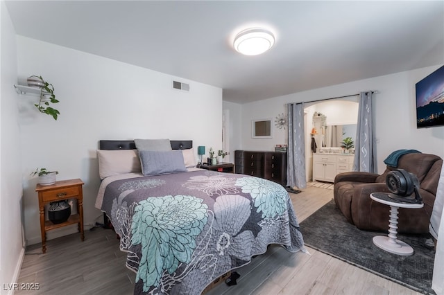 2990 Carnelian St, Las Vegas, NV 89121 - bedroom with wood finished floors and ensuite bath
