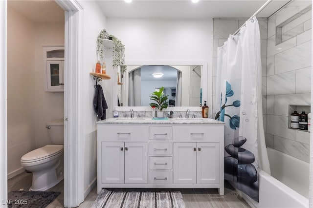 2990 Carnelian St, Las Vegas, NV 89121 - bathroom featuring double vanity, wood finished floors, and shower / bath combo