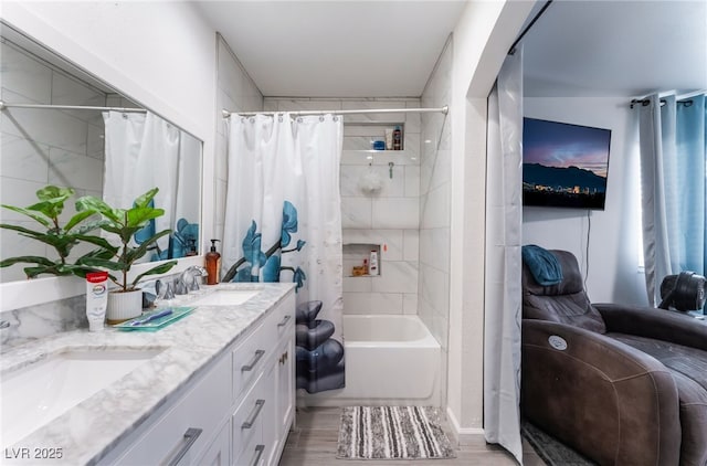 2990 Carnelian St, Las Vegas, NV 89121 - full bath featuring double vanity, shower / bath combo with shower curtain, and wood finished floors