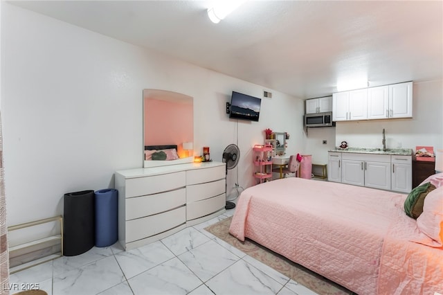 2990 Carnelian St, Las Vegas, NV 89121 - bedroom featuring light marble finish flooring and a sink