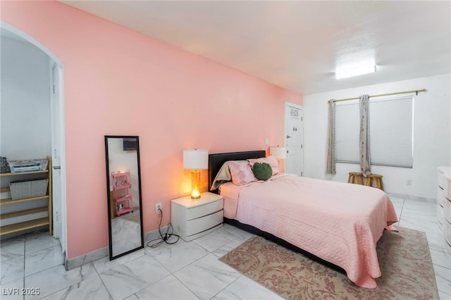 2990 Carnelian St, Las Vegas, NV 89121 - bedroom with light marble finish flooring and arched walkways