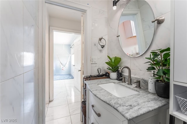 2990 Carnelian St, Las Vegas, NV 89121 - bathroom with marble look tiles and vanity