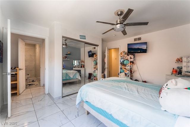 2990 Carnelian St, Las Vegas, NV 89121 - bedroom featuring a closet, light marble finish floors, and ceiling fan