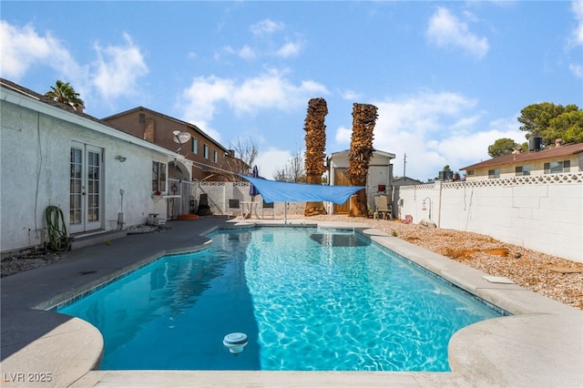 2990 Carnelian St, Las Vegas, NV 89121 - view of swimming pool with french doors, a fenced backyard, and a patio area