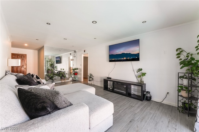 2990 Carnelian St, Las Vegas, NV 89121 - living area with wood finished floors, recessed lighting, and crown molding