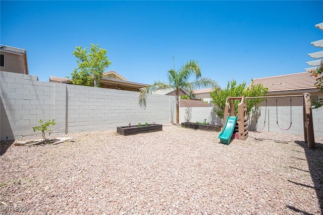 7021 Salt Marsh Ct, Las Vegas, NV 89148 - fenced backyard featuring a playground and a garden