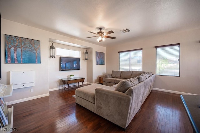 7021 Salt Marsh Ct, Las Vegas, NV 89148 - living area with dark wood-style flooring and ceiling fan