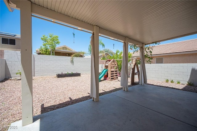 7021 Salt Marsh Ct, Las Vegas, NV 89148 - fenced backyard with a patio area and a playground