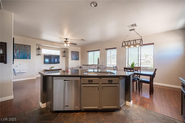 7021 Salt Marsh Ct, Las Vegas, NV 89148 - kitchen featuring dishwasher, an island with sink, gray cabinets, ceiling fan, and open floor plan
