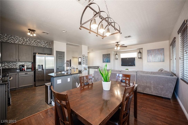 7021 Salt Marsh Ct, Las Vegas, NV 89148 - dining area featuring dark wood-style flooring and ceiling fan