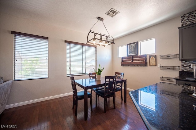 7021 Salt Marsh Ct, Las Vegas, NV 89148 - dining area with dark wood-style floors, plenty of natural light, and a chandelier