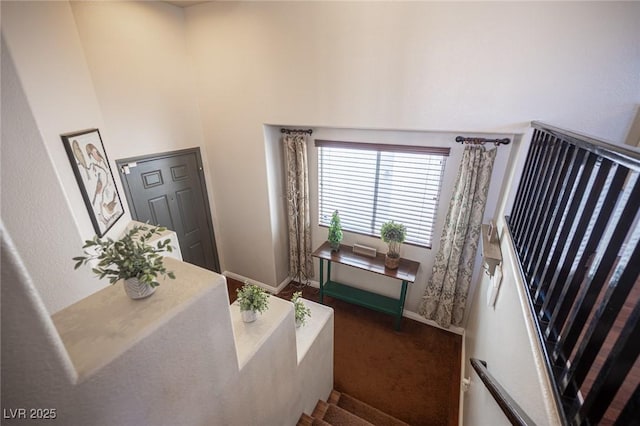 7021 Salt Marsh Ct, Las Vegas, NV 89148 - stairs featuring carpet floors and a high ceiling