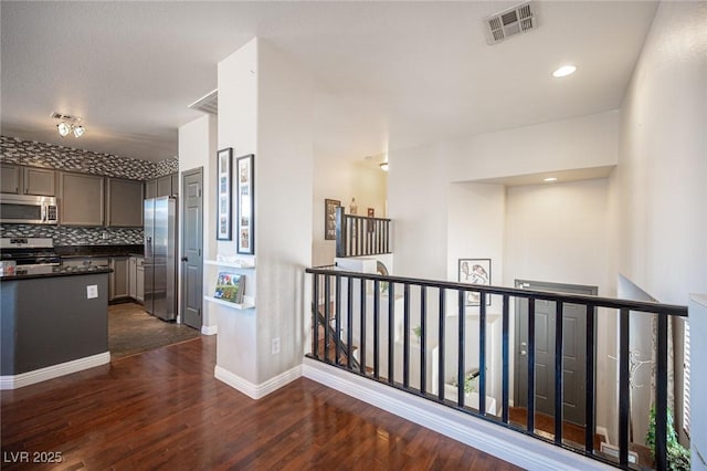 7021 Salt Marsh Ct, Las Vegas, NV 89148 - hallway with an upstairs landing and dark wood-type flooring