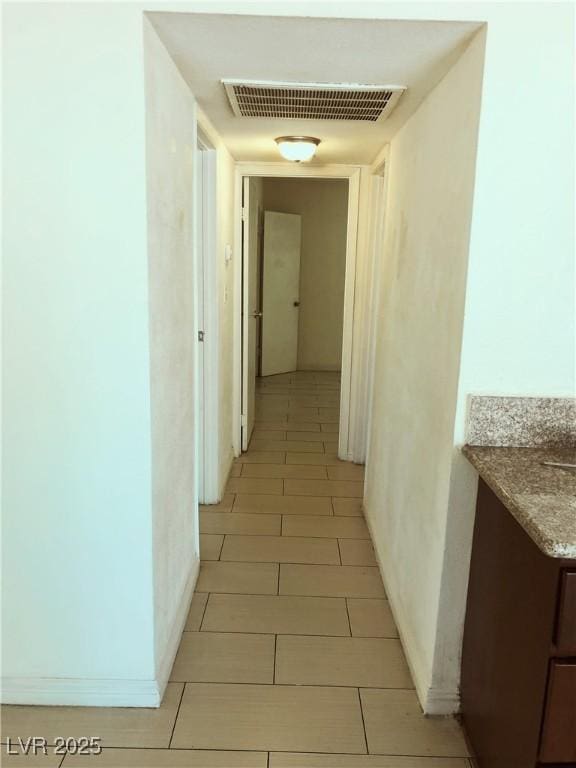 6196 W University Ave, Las Vegas, NV 89103 - hallway featuring light tile patterned floors