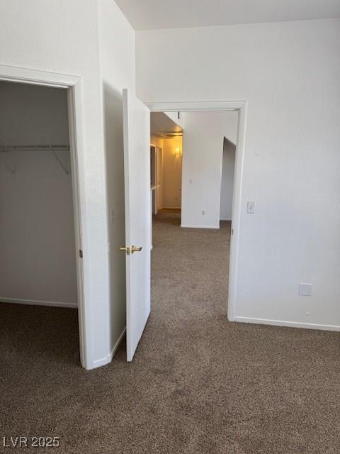 2019 Rancho Lake Dr Unit 102, Las Vegas, NV 89108 - unfurnished bedroom featuring carpet flooring, a spacious closet, and a closet