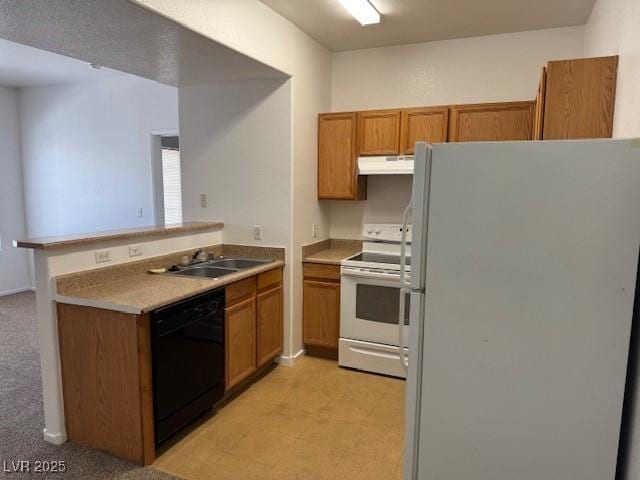 2019 Rancho Lake Dr Unit 102, Las Vegas, NV 89108 - kitchen featuring white appliances, a peninsula, under cabinet range hood, brown cabinets, and light countertops