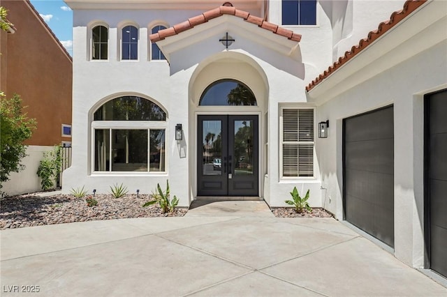 2469 Sun Reef Rd, Las Vegas, NV 89128 - entrance to property featuring french doors, stucco siding, and a tiled roof