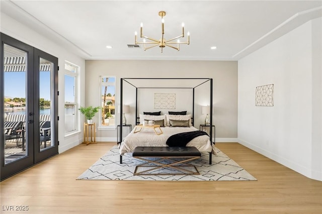 2469 Sun Reef Rd, Las Vegas, NV 89128 - bedroom with a chandelier, access to exterior, french doors, light wood-style floors, and recessed lighting