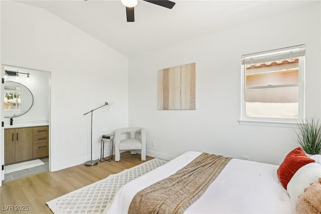 2469 Sun Reef Rd, Las Vegas, NV 89128 - bedroom with light wood finished floors, lofted ceiling, connected bathroom, and ceiling fan